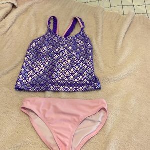 A purple and pink mermaid bathing suit